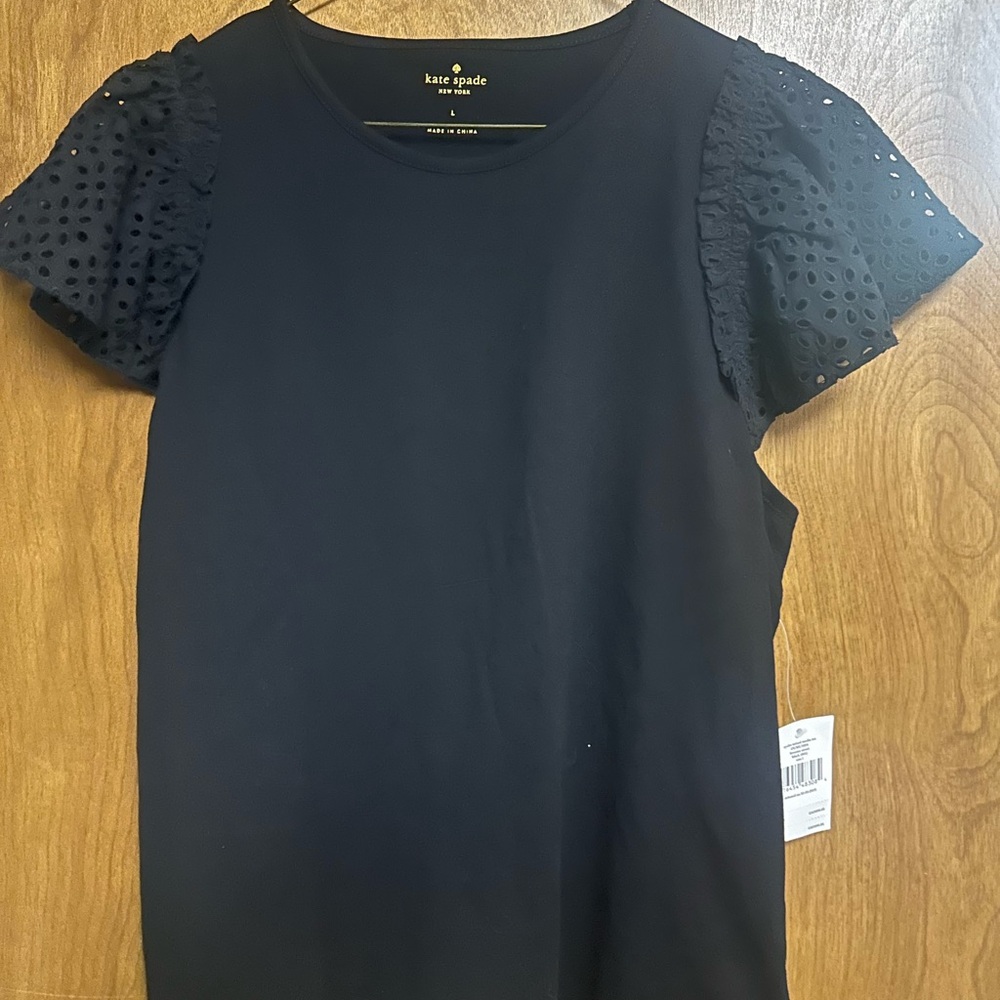 Kate Spade black top with eyelet sleeves NWT